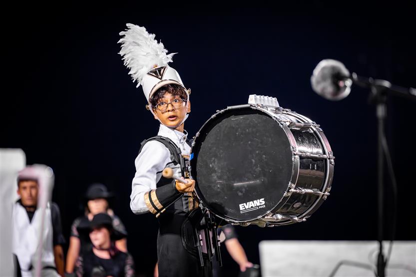 Students perform on football field